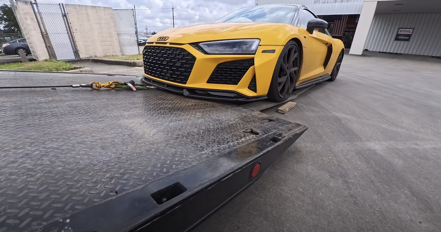 Flatbed Towing - Secure transport for luxury and high-value vehicles High-end sports car being loaded onto professional flatbed tow truck